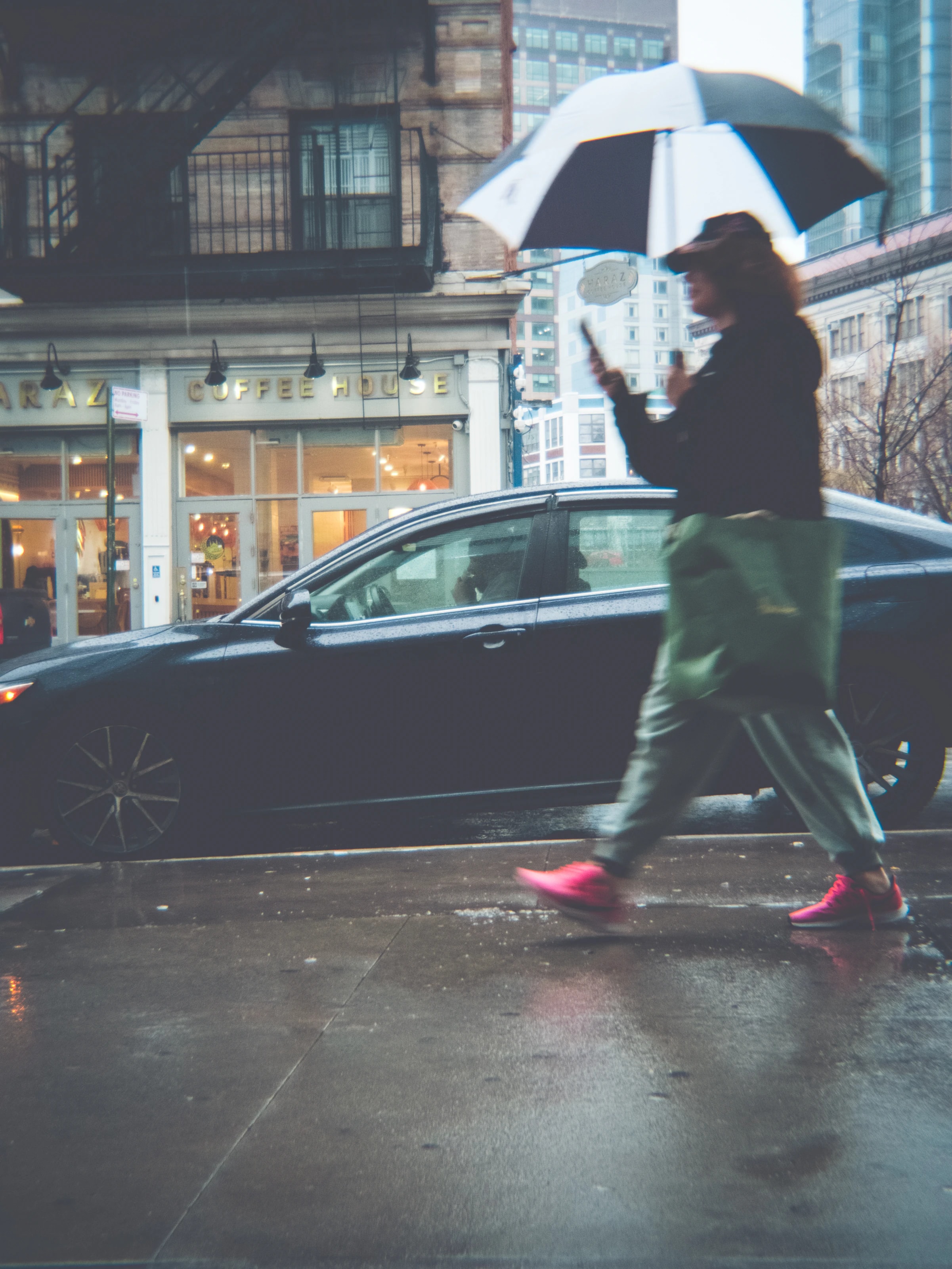 Woman with an umbrella walking in the rain, New York