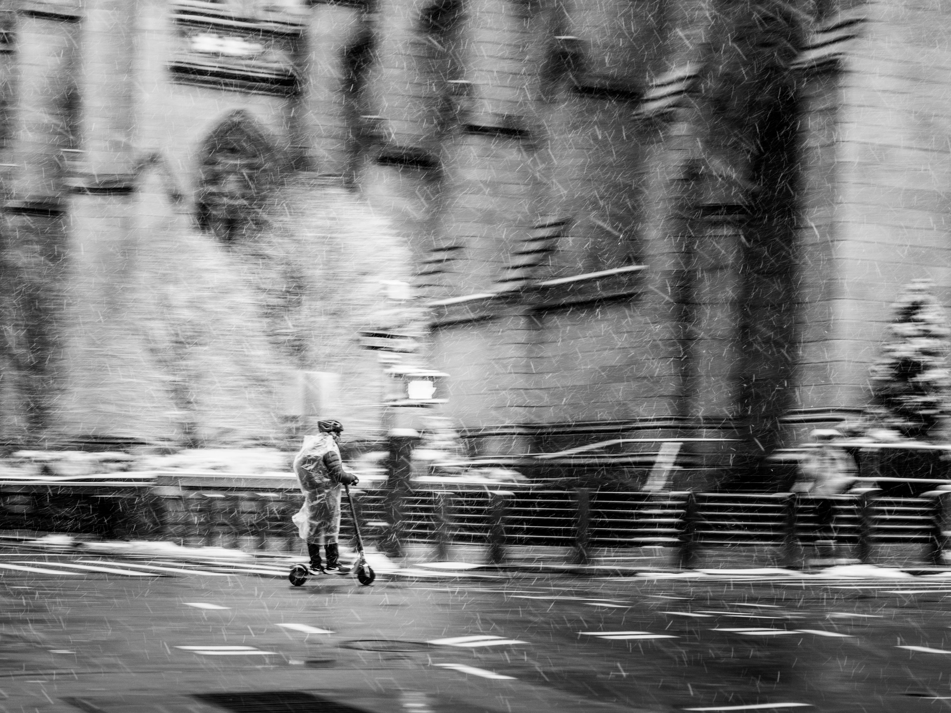 Person on a scooter in a snowstorm, New York